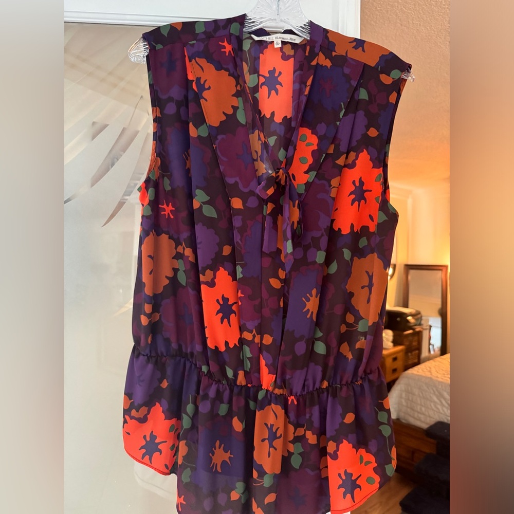 Rachel Roy sleeveless top.  Cinched waist.